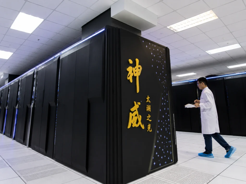China Overtakes US to Claim World’s Most Powerful Supercomputer A server room corridor inside a high-tech data center featuring row cabinets of China supercomputer architecture.