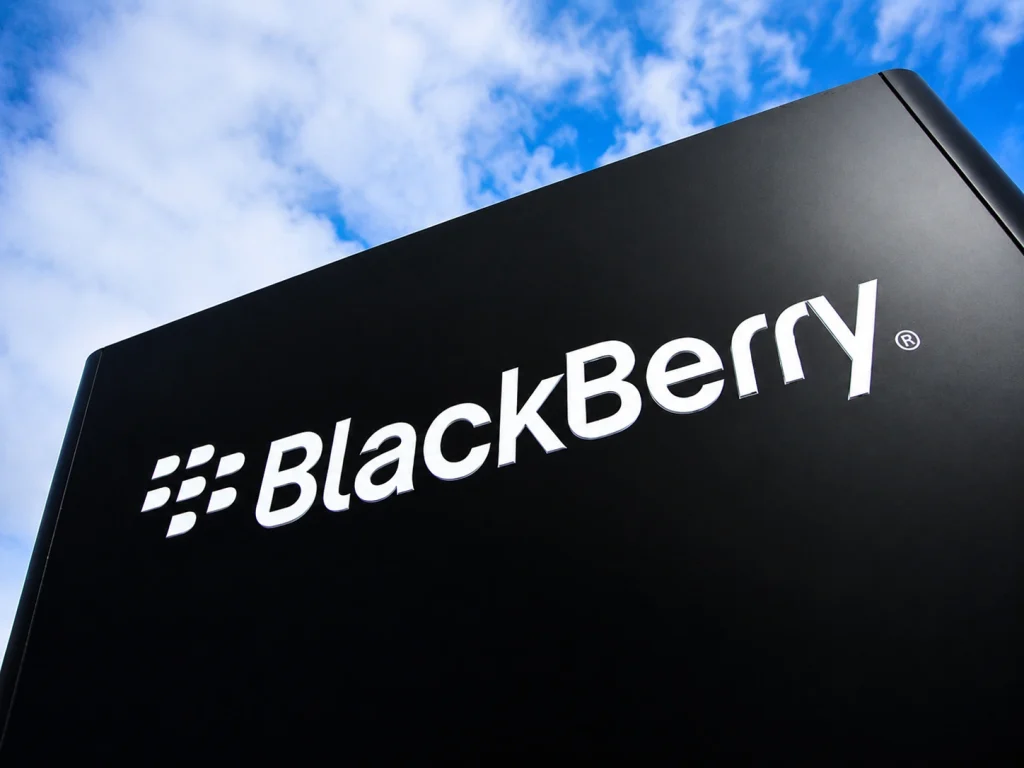 BlackBerry Reinvents Itself Far Beyond Smartphones Advanced automated assembly arms operating smoothly in a high-tech facility, showcasing the real-time embedded systems driving the BlackBerry comeback.